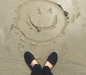 smiley-drawing-on-sand-698899