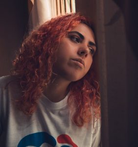 woman-in-white-blue-and-red-printed-shirt-with-sad-face-3264253