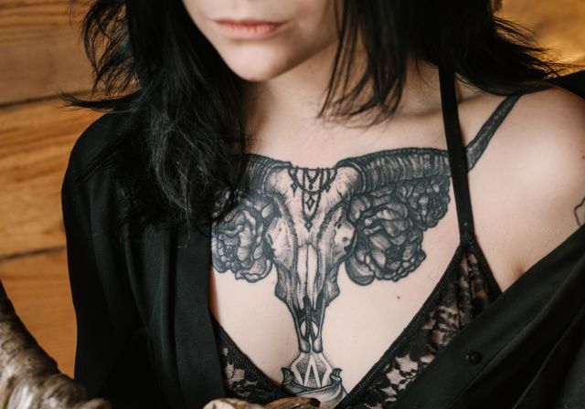  crop-woman-with-cool-tattoos-and-animal-skull-4530487